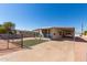 Mobile home exterior with carport and landscaping at 630 S 93Rd Pl, Mesa, AZ 85208