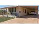 Single-wide manufactured home with carport and paved driveway at 630 S 93Rd Pl, Mesa, AZ 85208