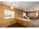 Kitchen with breakfast bar and wood cabinets at 630 S 93Rd Pl, Mesa, AZ 85208