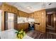 Modern kitchen with stainless steel appliances and wood cabinets at 630 S 93Rd Pl, Mesa, AZ 85208