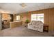 Living room with view of kitchen and wood paneling at 630 S 93Rd Pl, Mesa, AZ 85208