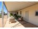 Covered patio furnished with comfortable seating at 630 S 93Rd Pl, Mesa, AZ 85208