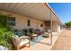 Extended covered patio with seating area and plants at 630 S 93Rd Pl, Mesa, AZ 85208