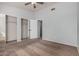 Spacious bedroom with mirrored closet doors and upper hallway access at 6454 E University Dr # 24, Mesa, AZ 85205