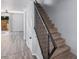 Modern staircase with black metal railing and carpet at 6454 E University Dr # 24, Mesa, AZ 85205