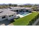 Aerial view of the home showcasing the modern design, lush backyard, and sparkling pool at 6614 E North Ln, Paradise Valley, AZ 85253