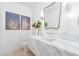 Modern bathroom with a marble vanity, elegant fixtures, and contemporary design elements at 6614 E North Ln, Paradise Valley, AZ 85253