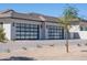 Spacious garage with contemporary glass doors and ample parking at 6614 E North Ln, Paradise Valley, AZ 85253