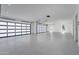 Bright and spacious garage interior with epoxy floors, modern doors, and recessed lighting at 6614 E North Ln, Paradise Valley, AZ 85253