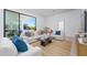 Bright living room with stylish furnishings, a neutral color palette, and large windows showcasing the backyard at 6614 E North Ln, Paradise Valley, AZ 85253