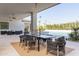 Outdoor dining area with a large table and stylish chairs, perfect for entertaining at 6614 E North Ln, Paradise Valley, AZ 85253