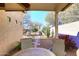 Landscaped backyard with patio and seating area at 6808 S 36Th Dr, Phoenix, AZ 85041