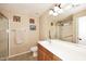 Bathroom with a large mirror, vanity, and shower at 6808 S 36Th Dr, Phoenix, AZ 85041