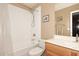 Clean bathroom with white subway tile and oak vanity at 6808 S 36Th Dr, Phoenix, AZ 85041