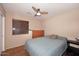 Cozy bedroom with wood floors and ceiling fan at 6808 S 36Th Dr, Phoenix, AZ 85041