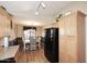 Kitchen dining area with wood flooring and a white table at 6808 S 36Th Dr, Phoenix, AZ 85041