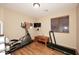 Home exercise room with elliptical, treadmill, and weights at 6808 S 36Th Dr, Phoenix, AZ 85041