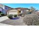 House exterior showcasing desert landscaping and a two-car garage at 6808 S 36Th Dr, Phoenix, AZ 85041