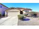 Single-story home with two-car garage and desert landscaping at 6808 S 36Th Dr, Phoenix, AZ 85041