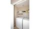 Laundry room with washer, dryer, and shelving at 6808 S 36Th Dr, Phoenix, AZ 85041