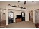 Open living area with built-in shelving and hardwood floors at 6808 S 36Th Dr, Phoenix, AZ 85041