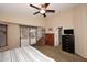 Main bedroom with dresser, ceiling fan and patio access at 6808 S 36Th Dr, Phoenix, AZ 85041