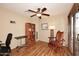 Home office with hardwood floors, a rocking chair, and built-in shelves at 6808 S 36Th Dr, Phoenix, AZ 85041