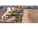 Aerial view of backyard oasis with patio, landscaping, and community views at 6863 E Haven Ave, Florence, AZ 85132