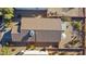 Aerial view showing home's tile roof, backyard, and landscaping at 6863 E Haven Ave, Florence, AZ 85132