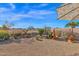 Landscaped backyard with seating area and fire pit at 6863 E Haven Ave, Florence, AZ 85132