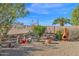 Landscaped backyard with desert plants and seating area at 6863 E Haven Ave, Florence, AZ 85132