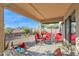 Relaxing covered patio with seating area, overlooking a desert landscape at 6863 E Haven Ave, Florence, AZ 85132