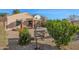 Landscaped backyard with gravel, desert plants, and a fire pit at 6863 E Haven Ave, Florence, AZ 85132