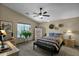 Spacious bedroom with a ceiling fan and southwestern decor at 6863 E Haven Ave, Florence, AZ 85132