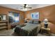 Comfortable bedroom with ceiling fan and large window at 6863 E Haven Ave, Florence, AZ 85132