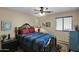 Charming bedroom with dark wood furniture and southwestern bedding at 6863 E Haven Ave, Florence, AZ 85132