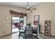 Kitchen dining area with a round table and access to the backyard at 6863 E Haven Ave, Florence, AZ 85132