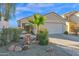 Single-story house with a two-car garage and well-maintained landscaping at 6863 E Haven Ave, Florence, AZ 85132