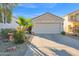 Single-story house with attached garage and desert landscaping at 6863 E Haven Ave, Florence, AZ 85132