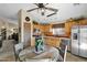 Kitchen features oak cabinets and stainless steel appliances at 6863 E Haven Ave, Florence, AZ 85132