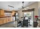 Kitchen with oak cabinets, stainless steel appliances, and a dining area at 6863 E Haven Ave, Florence, AZ 85132