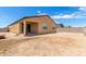 View of backyard with house and empty lot at 7110 E Gamebird Way, San Tan Valley, AZ 85143