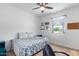 Guest bedroom with a queen bed and ceiling fan at 7110 E Gamebird Way, San Tan Valley, AZ 85143