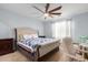 Spacious bedroom with a king-size bed, chair, and ceiling fan at 7110 E Gamebird Way, San Tan Valley, AZ 85143