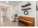 Inviting entryway with a piano, desk, and built-in shelving at 7110 E Gamebird Way, San Tan Valley, AZ 85143