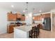 Well-equipped kitchen with an island and stainless steel appliances at 7110 E Gamebird Way, San Tan Valley, AZ 85143