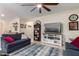 Living room with sectional sofa, and built-in shelving at 7110 E Gamebird Way, San Tan Valley, AZ 85143