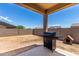 Patio with grill and dog house at 7110 E Gamebird Way, San Tan Valley, AZ 85143