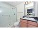 Modern bathroom with a glass shower and granite vanity at 7275 N Scottsdale Rd # 1001, Paradise Valley, AZ 85253