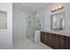 Modern bathroom with marble tile, walk-in shower, and double vanity at 7275 N Scottsdale Rd # 1001, Paradise Valley, AZ 85253